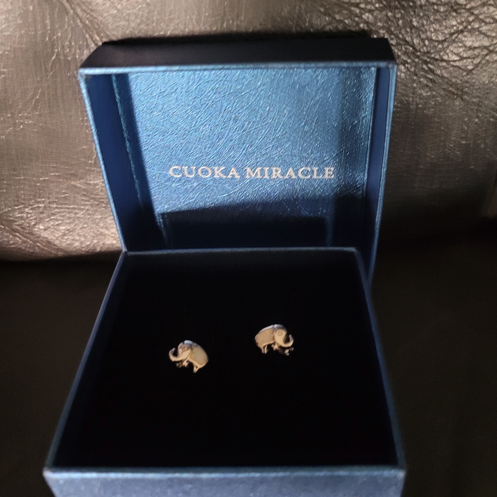 Cuoka Miracle pierced elephant earrings.